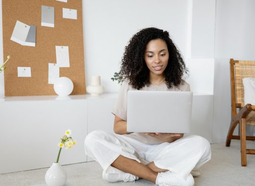 Smiling Woman with Laptop in Her Lap