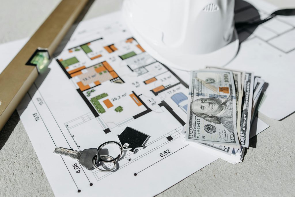 Home Floorplans with House Keys Sitting on Top