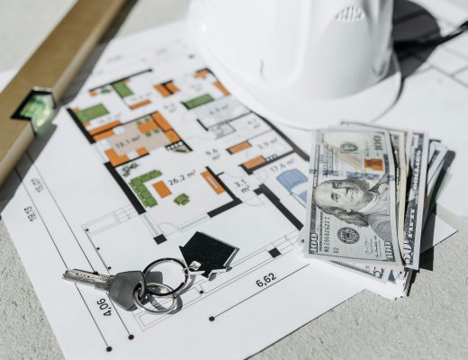 Home Floorplans with House Keys Sitting on Top