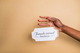 Wooden Sign That Says Women Owned Business