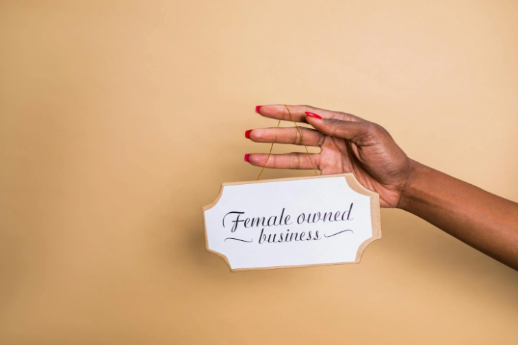 Wooden Sign That Says Women Owned Business