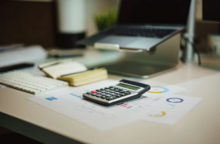 Calculator Sitting on Financial Paperwork