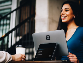 Smiling Woman Interacting with a Customer