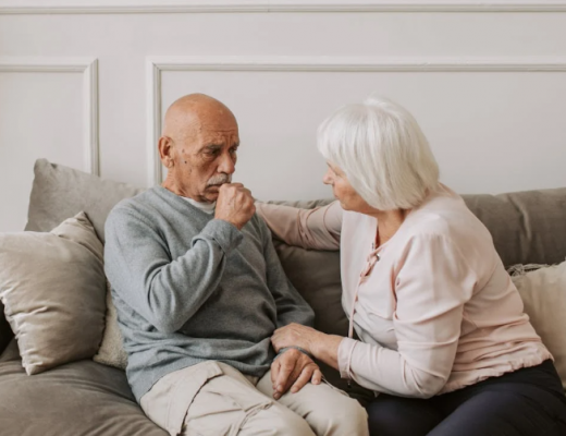 Elderly Woman Comforting Sick Elderly Man