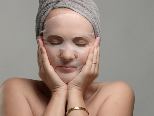 Woman Wearing a Facial Mask for Moisturizing