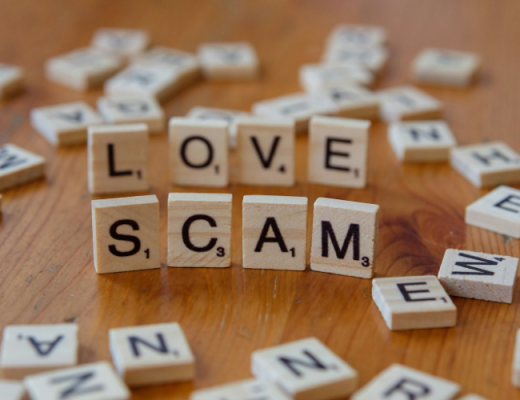 Love and Scam Written in Scrabble Tiles