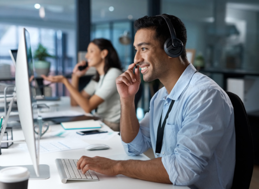 Side Profile of a Smiling Man Talking on a Headset