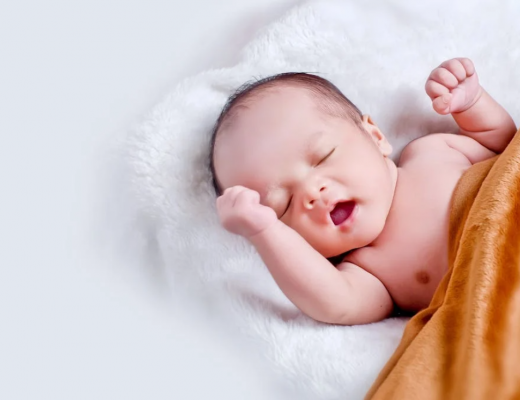 Sleeping Baby Wrapped in Mustard Yellow Blanket