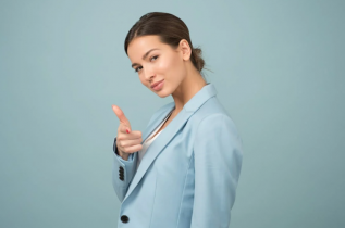 Smiling Woman Wearing a Blue Suit Jacket