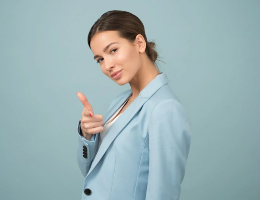 Smiling Woman Wearing a Blue Suit Jacket