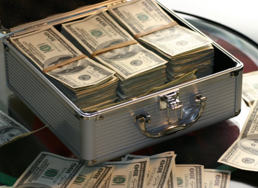 Metal Case Full of Money and Sitting on a Table