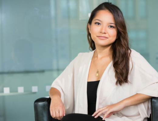 Business Woman with Long Brown Hair Posed in Office Chair