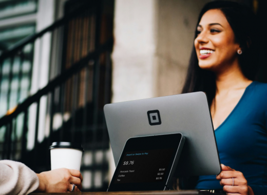 Smiling Woman Providing Customer Service