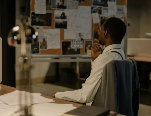 Investigator Looking at His Notes on the Wall