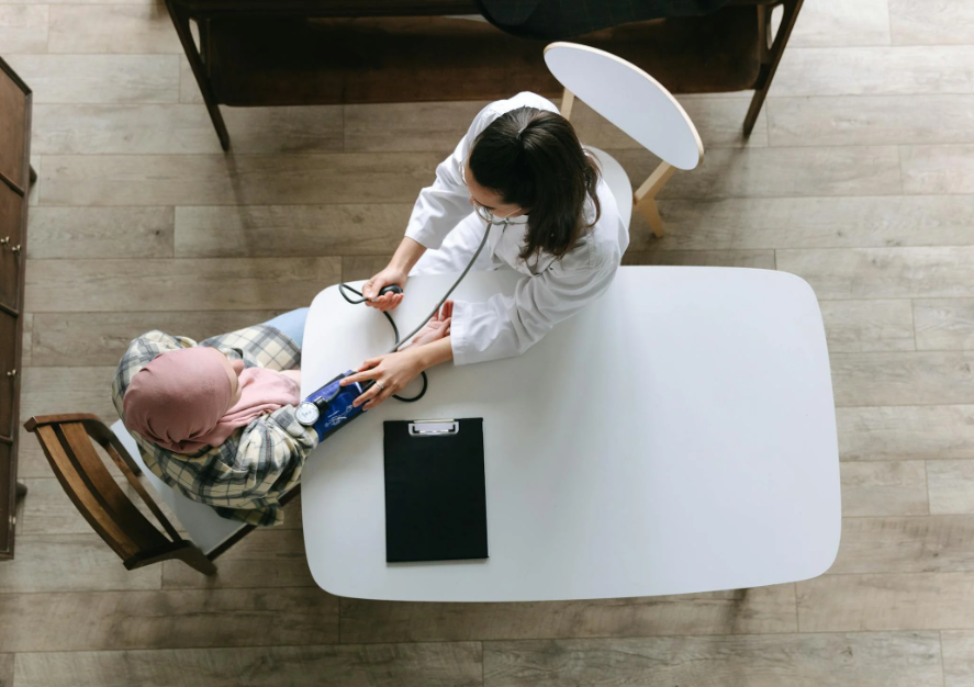 Aerial View of a Doctor with an Elderly Patient