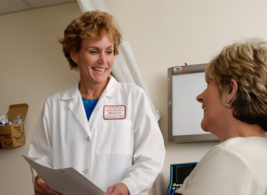 Smiling Female Doctor Smiling at a Patient