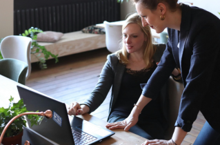 2 Women Working on a Laptop