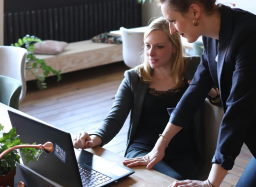 2 Women Working on a Laptop