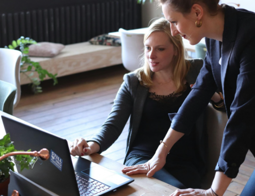 2 Women Working on a Laptop