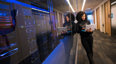 Woman Standing in a Server Room