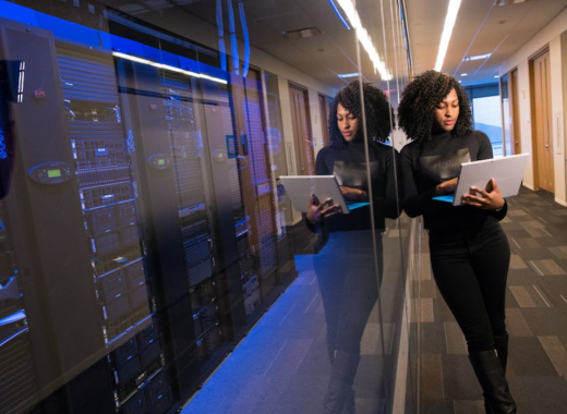Woman Standing in a Server Room