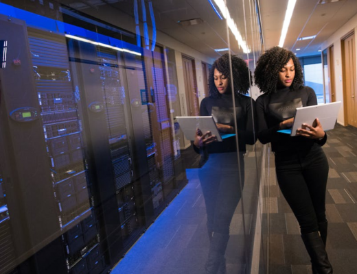 Woman Standing in a Server Room