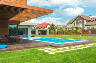 Well Manicured Yard with a Pool