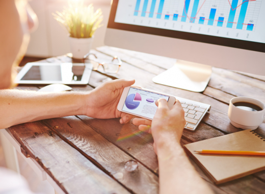 Marketing Metrics on a Computer Screen and Smartphone