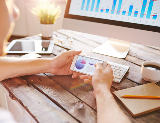 Marketing Metrics on a Computer Screen and Smartphone