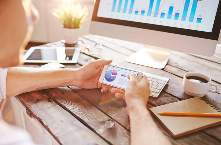 Marketing Metrics on a Computer Screen and Smartphone