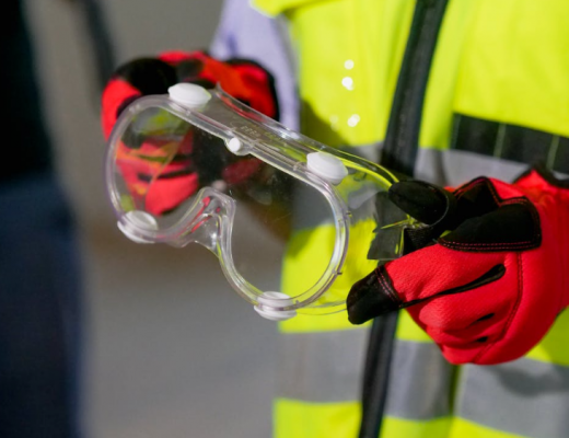 Close Up of Someone Holding Safety Goggles