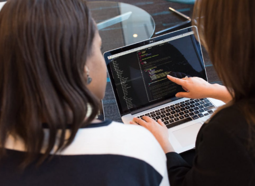 2 Woman Looking at a Laptop Screen