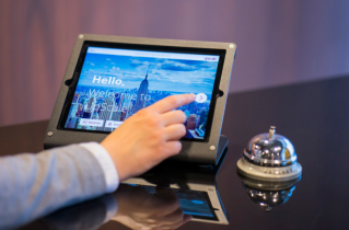 Man Typing on a Touchscreen Tablet