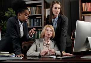 Group of 3 Female Attorneys Looking at a Computer Monitor