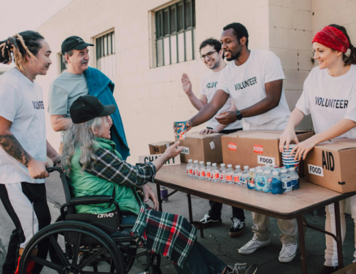 Volunteers Engaging with a Woman in a Wheelchair
