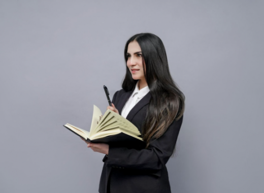 Female with Long Dark Hair Holding a Book
