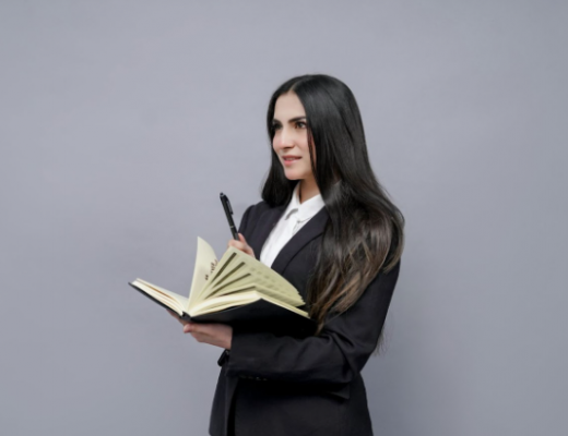Female with Long Dark Hair Holding a Book