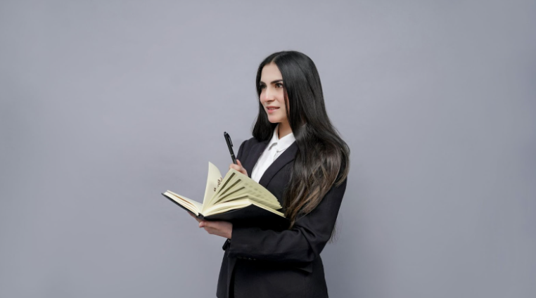 Female with Long Dark Hair Holding a Book