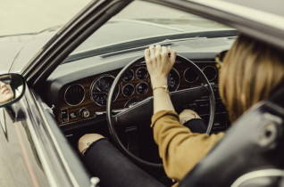 Woman Sitting in the Drivers Seat of a Car