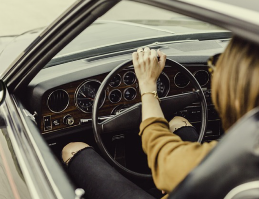 Woman Sitting in the Drivers Seat of a Car