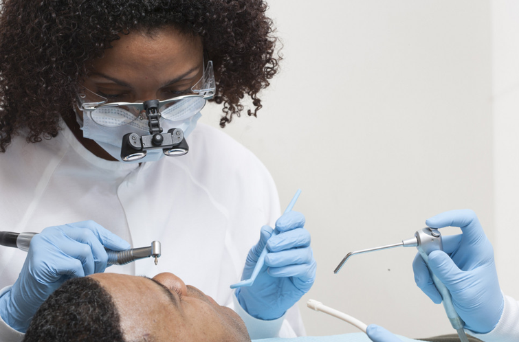 African American Female Dentist with a Patient