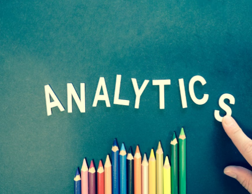 The Word Analytics Spelled Out Next to Colored Pencils