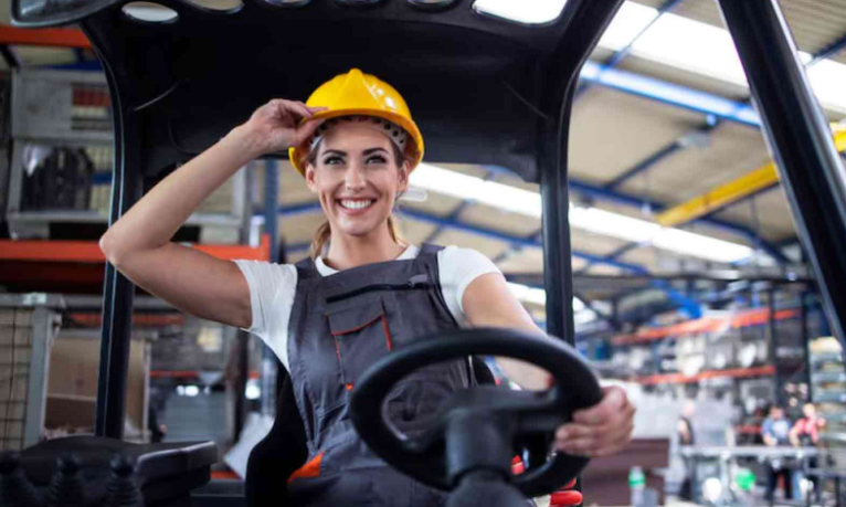 Smiling Woman Wearing a Hardhat at a Construction Site