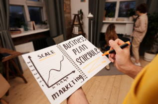 Notebook with Handwritten Notes about Business Planning