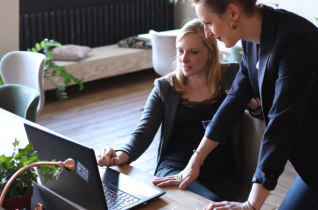 2 Women Looking at a Laptop Screen