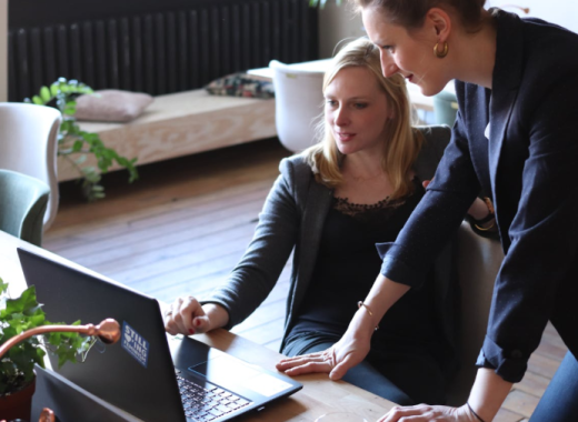 2 Women Looking at a Laptop Screen