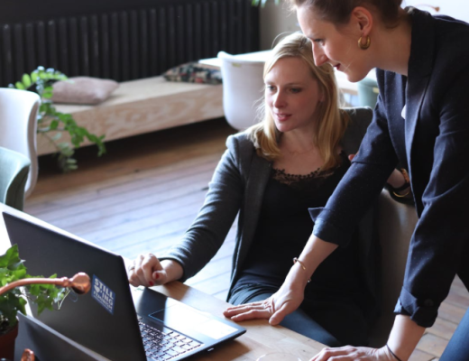 2 Women Looking at a Laptop Screen
