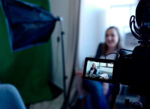 Businesswoman Sitting in Front of a Video Camera