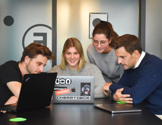 2 Female and 2 Male Millenials Looking at a Laptop Screen