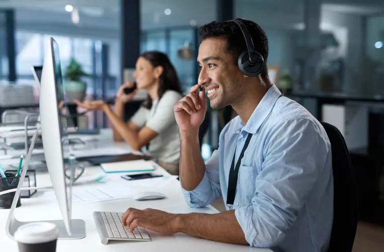 Side Profile of a Smiling Man Talking on a Headset